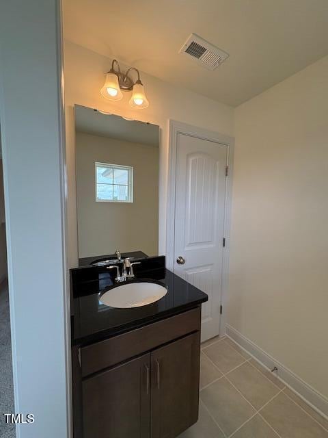 123 Sage Ln Unit 010, Four Oaks, NC 27524 - bathroom featuring vanity, baseboards, and tile patterned flooring
