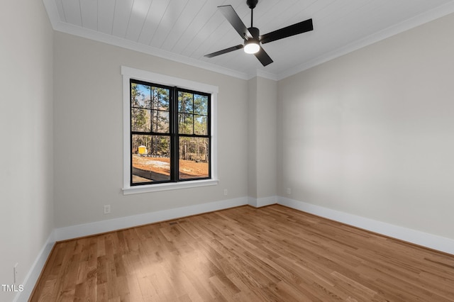 unfurnished room featuring crown molding, a ceiling fan, light wood-style flooring, and baseboards