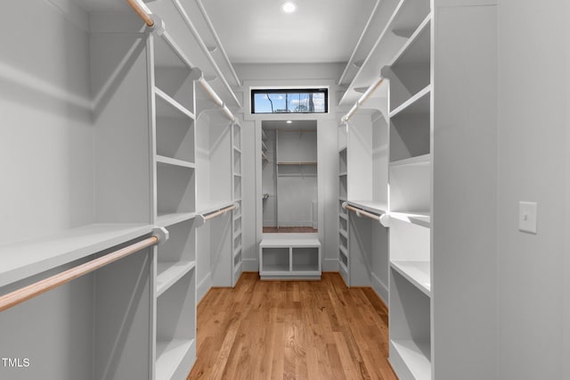 spacious closet featuring light wood-style flooring