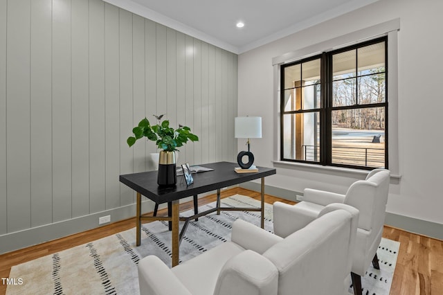 home office with light wood-style floors, baseboards, crown molding, and recessed lighting