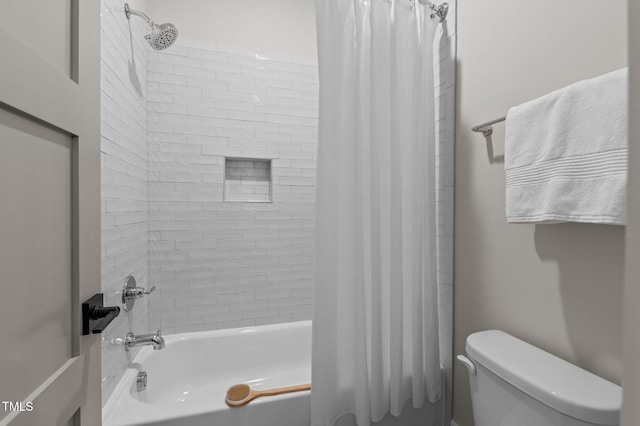 bathroom featuring shower / bath combo and toilet