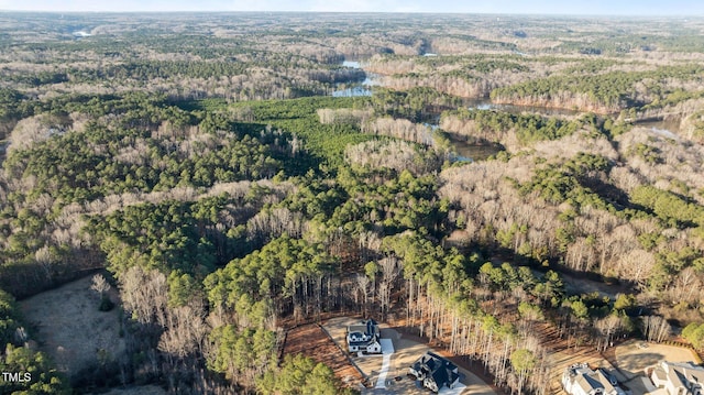 drone / aerial view with a view of trees