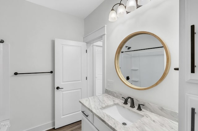 bathroom featuring hardwood / wood-style floors and vanity