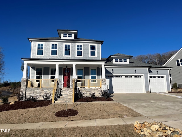 traditional style home featuring an attached garage, covered porch, and driveway