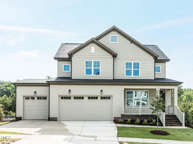 craftsman inspired home with concrete driveway, a porch, roof with shingles, and a garage
