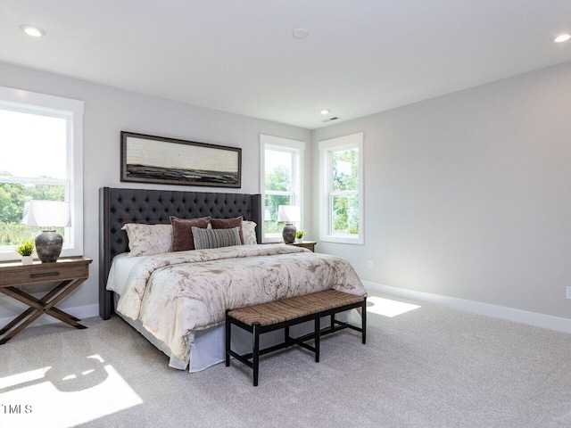 bedroom featuring baseboards, recessed lighting, and light colored carpet