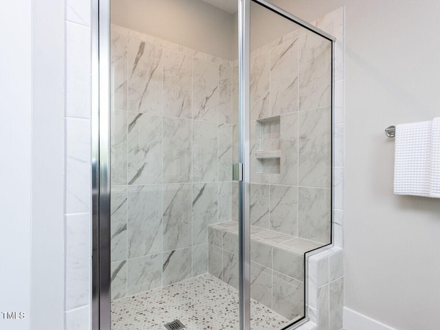 full bath with a shower stall