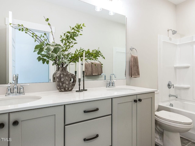 bathroom with double vanity and a sink