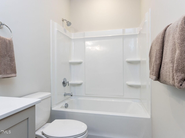 full bathroom featuring shower / bathing tub combination, vanity, and toilet