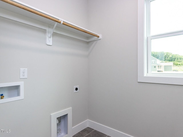 laundry room with baseboards, washer hookup, dark tile patterned floors, laundry area, and electric dryer hookup