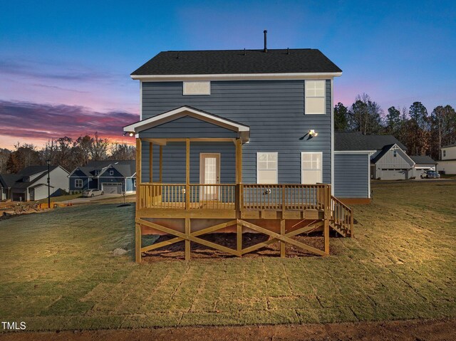 345 Sutherland Dr, Franklinton, NC 27525 - rear view of house with a wooden deck and a yard