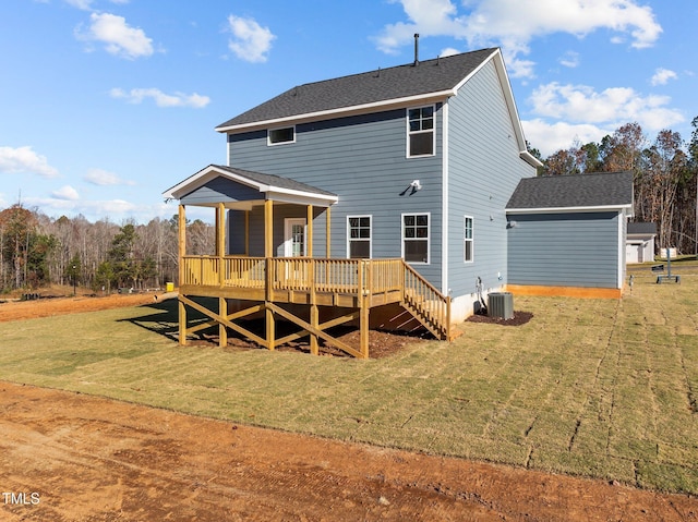 345 Sutherland Dr, Franklinton, NC 27525 - rear view of property featuring a lawn, a deck, cooling unit, and a shingled roof
