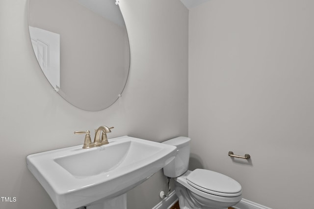 bathroom with sink and toilet