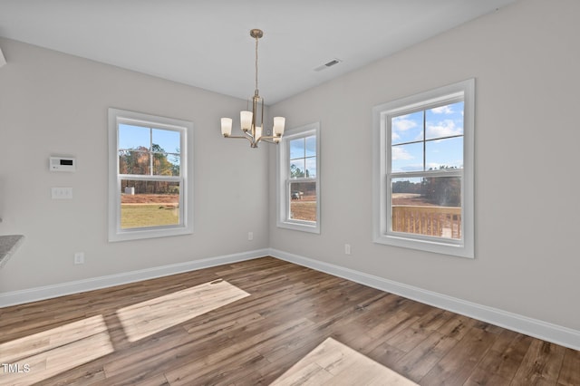 345 Sutherland Dr, Franklinton, NC 27525 - unfurnished dining area with healthy amount of natural light, wood finished floors, and baseboards
