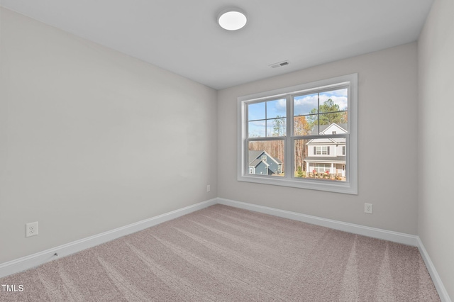 345 Sutherland Dr, Franklinton, NC 27525 - spare room featuring carpet flooring and baseboards