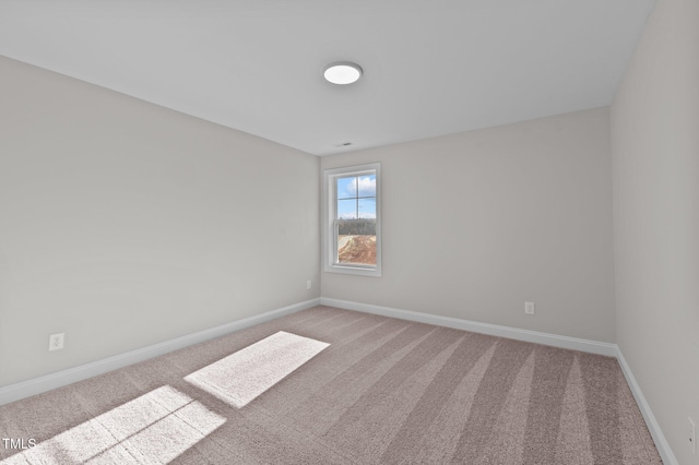 empty room with light colored carpet