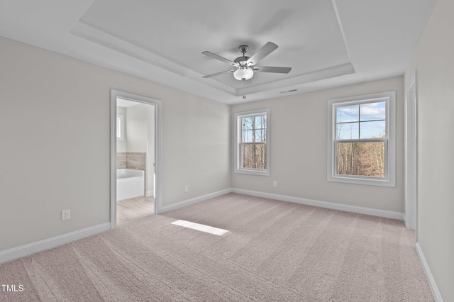 345 Sutherland Dr, Franklinton, NC 27525 - unfurnished room featuring a raised ceiling, light carpet, baseboards, and a ceiling fan