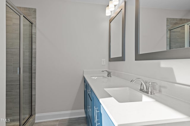 345 Sutherland Dr, Franklinton, NC 27525 - full bath with a shower stall, double vanity, and baseboards