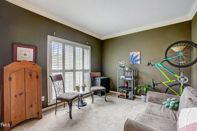 sitting room with a textured ceiling, ornamental molding, and light carpet