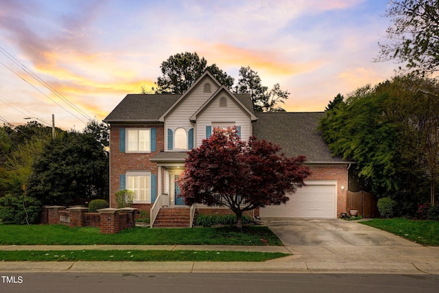 view of front of house with a lawn and a garage