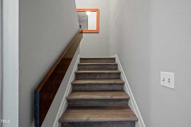 staircase featuring hardwood / wood-style flooring