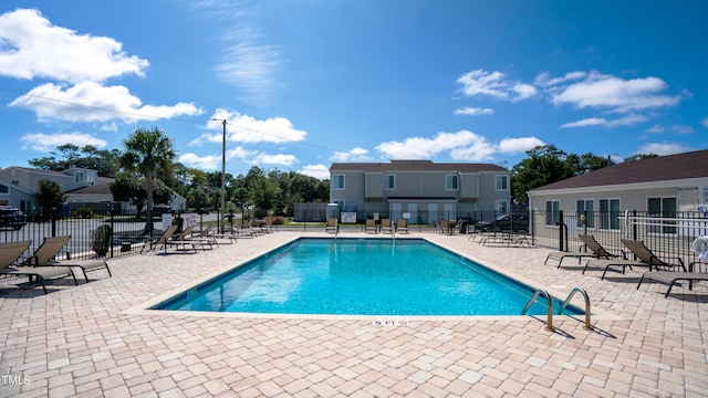 view of swimming pool with a patio