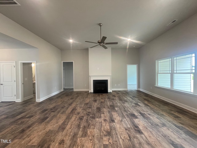 unfurnished living room featuring dark hardwood / wood-style flooring and ceiling fan