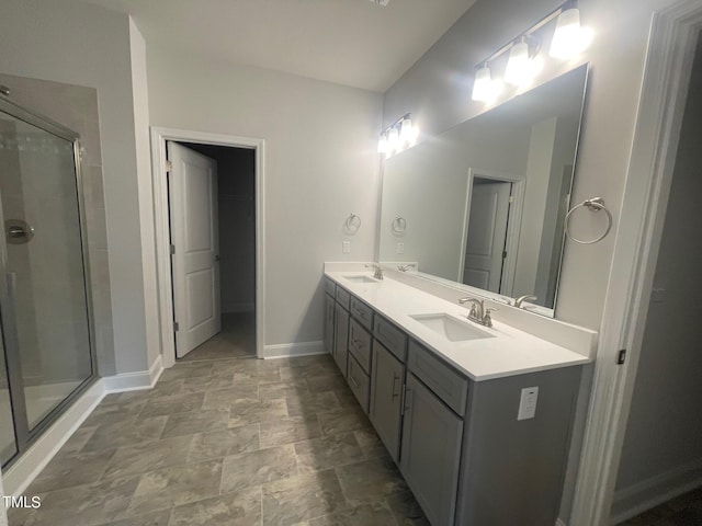 bathroom with an enclosed shower, double vanity, and tile patterned floors