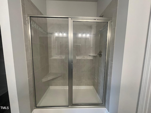 bathroom featuring an enclosed shower