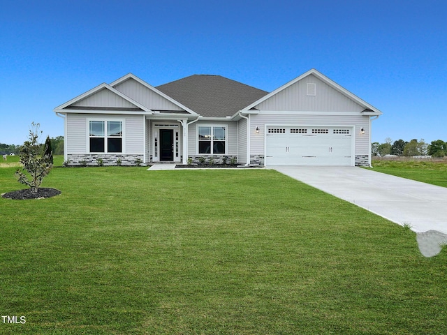 craftsman inspired home featuring a garage and a front lawn