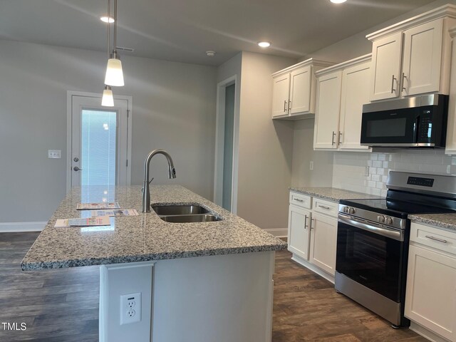 kitchen with white cabinetry, stainless steel electric stove, a kitchen island with sink, and sink