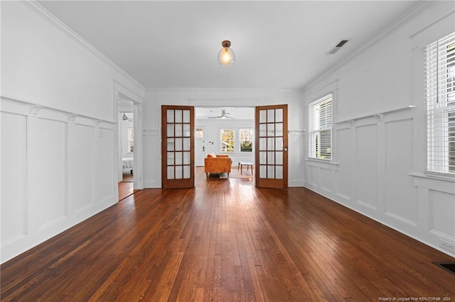 interior space featuring ornamental molding, ceiling fan, french doors, and dark hardwood / wood-style flooring