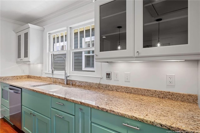 kitchen with dark hardwood / wood-style flooring, white cabinetry, light stone countertops, dishwasher, and ornamental molding