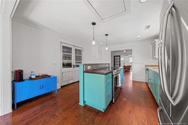 kitchen featuring hanging light fixtures, stainless steel appliances, ornamental molding, and dark hardwood / wood-style flooring