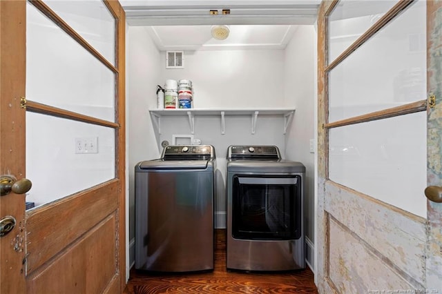 laundry room featuring crown molding, washer and clothes dryer, dark hardwood / wood-style floors, and hookup for a washing machine