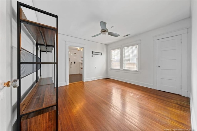 unfurnished room with ceiling fan and light hardwood / wood-style floors