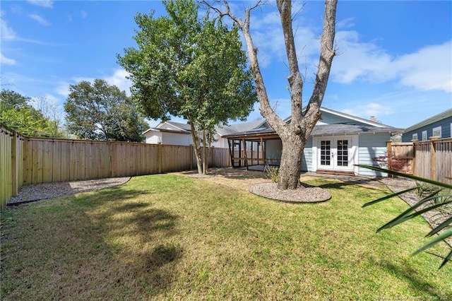 view of yard featuring french doors