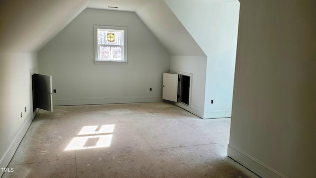 bonus room featuring vaulted ceiling