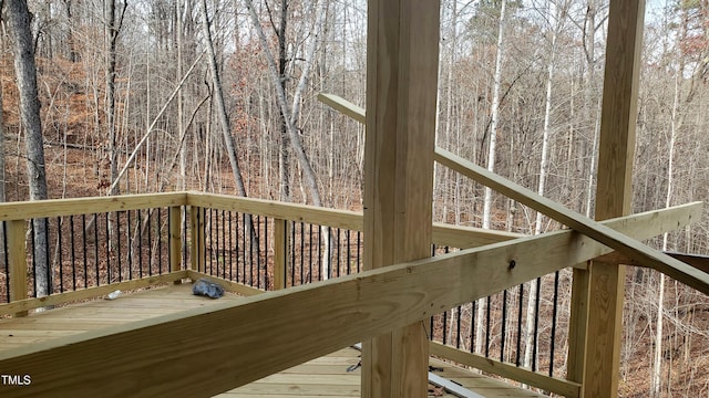 deck featuring a wooded view