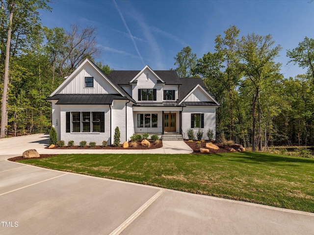122 W Beech Slope Ct, Chapel Hill, NC 27517 - modern farmhouse style home with board and batten siding, a standing seam roof, metal roof, french doors, and a front yard