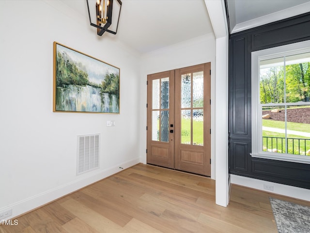 122 W Beech Slope Ct, Chapel Hill, NC 27517 - entrance foyer with a healthy amount of sunlight, french doors, light wood-style flooring, and visible vents