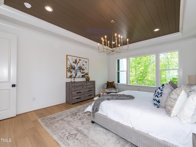122 W Beech Slope Ct, Chapel Hill, NC 27517 - bedroom with a raised ceiling, wood ceiling, wood finished floors, and a notable chandelier
