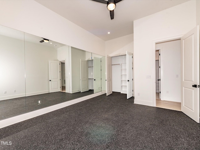 122 W Beech Slope Ct, Chapel Hill, NC 27517 - unfurnished bedroom featuring two closets, a ceiling fan, baseboards, and speckled floor