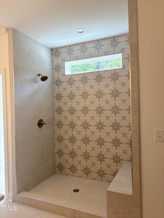 bathroom with tiled shower