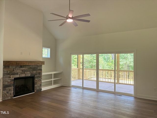 unfurnished living room with ceiling fan, a fireplace, hardwood / wood-style floors, and high vaulted ceiling