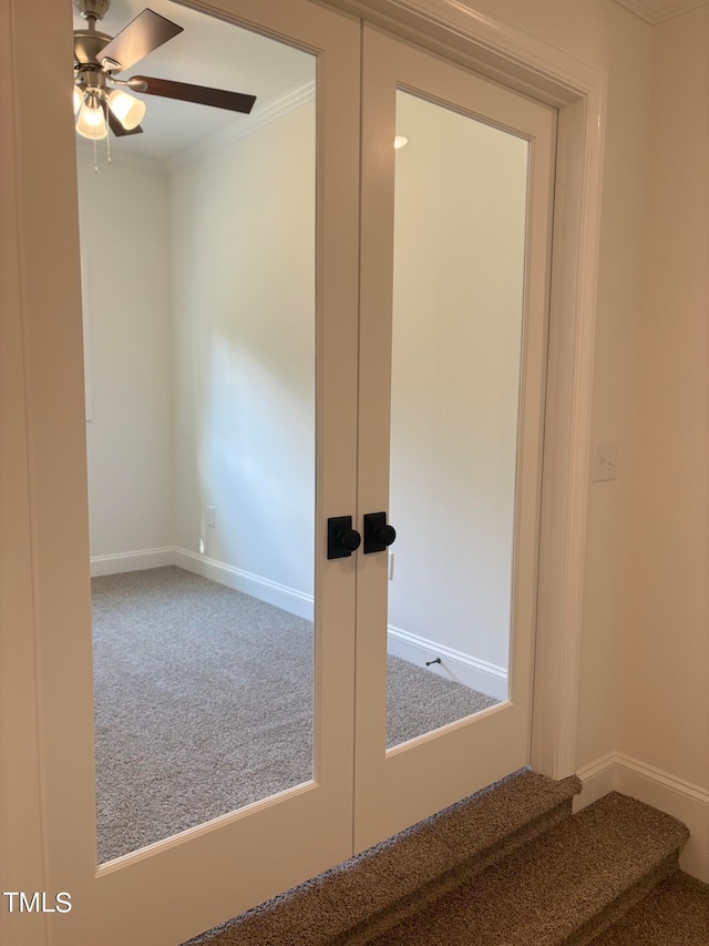 corridor featuring ornamental molding, carpet, and french doors