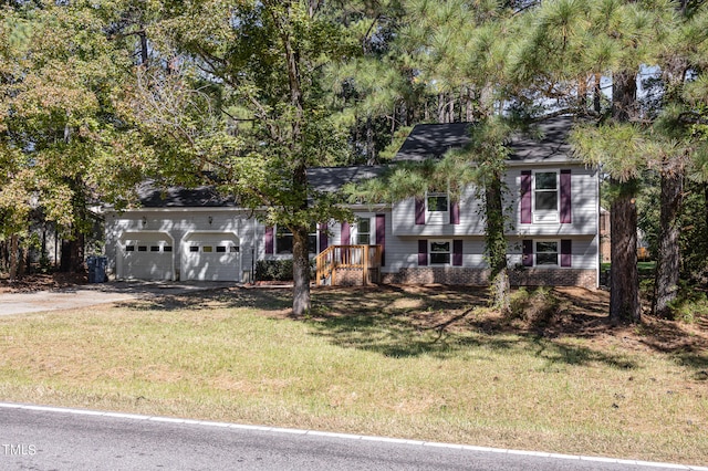 tri-level home with a front lawn and a garage