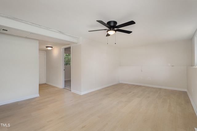 empty room with light hardwood / wood-style floors and ceiling fan