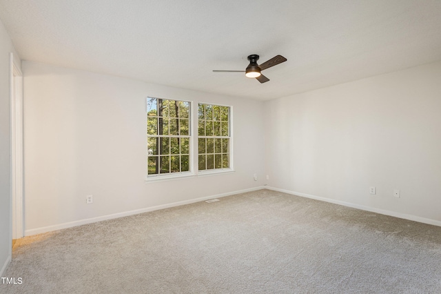 carpeted empty room with ceiling fan