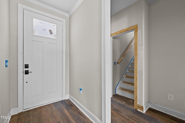 foyer with dark hardwood / wood-style floors and ornamental molding